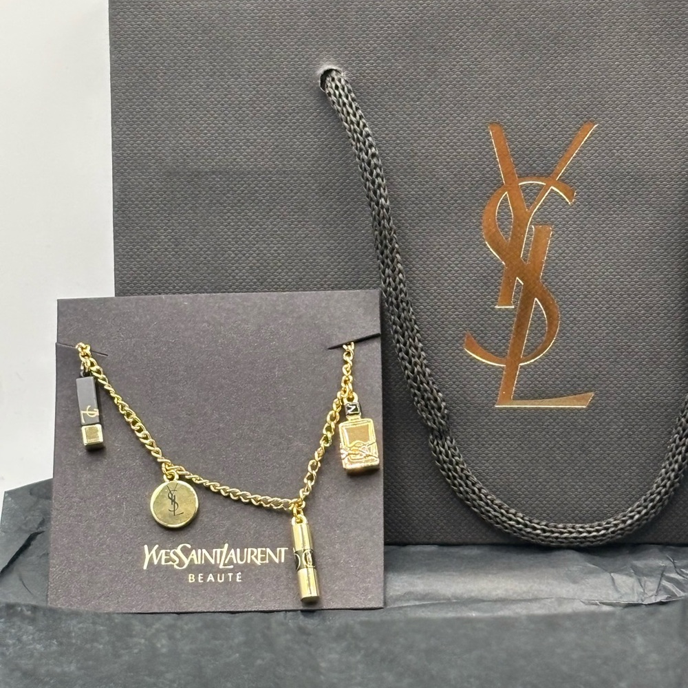 Yves Saint Laurent Gold Tone Charm Bracelet